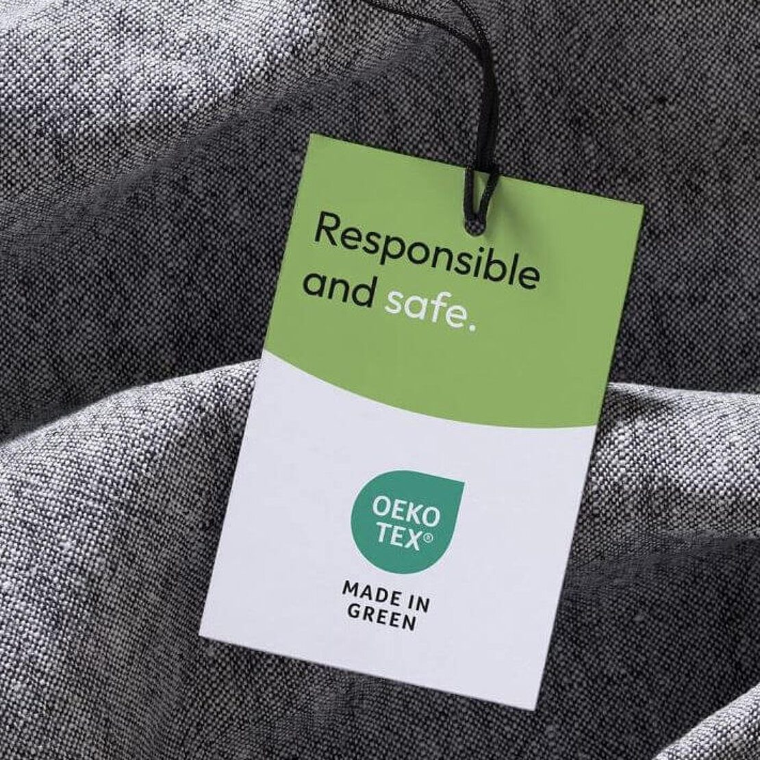 Grey fabric with a MADE IN GREEN hangtag